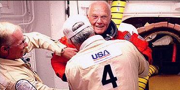 John Glenn suiting up