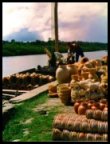 Saveiro being loaded with pottery bound for market in Salvador