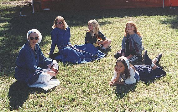 The Pied Pipers (children's programme run thru Festival) relaxing on the Village Green