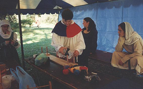 Lord Dominic of Oxford teaching tablet weaving