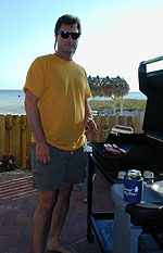 Grilling hot dogs beachside