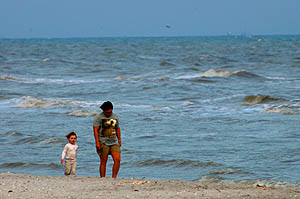 The girls walking Tarpon Beach, Sanibel, Florida