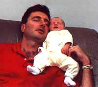 My favorite place to sleep is in someone's arms, but Dad's shoulder is pretty good too