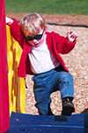 Climbing on the toddler's gym