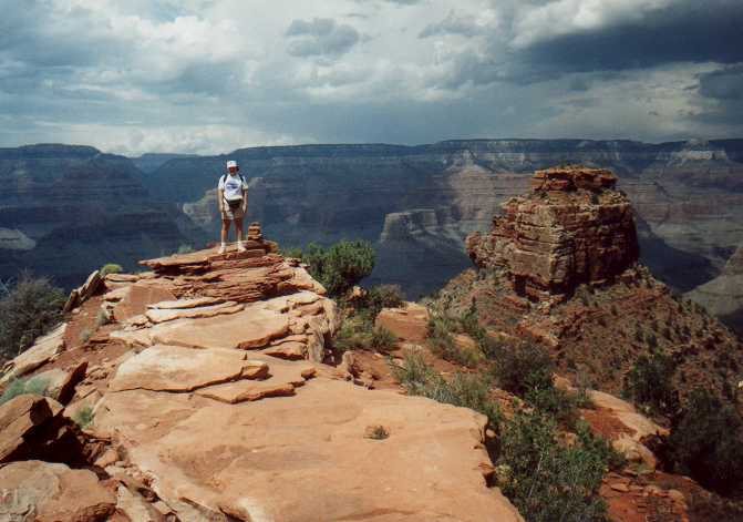 Angie by a cairn halfway into the Grand Canyon