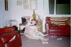 Cassie sitting with Georgie over one shoulder and a relaxed Pele in her lap