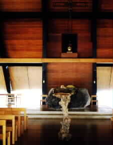 Altar made of volcanic rock found by Fr. Columbano and rolled
into the church. 1/3 of the rock is buried under the floor.
