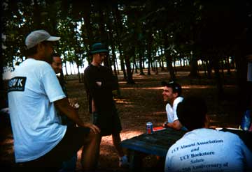 The group discusses whether Paul will draft Dan Marino or Herman Moore with his first pick