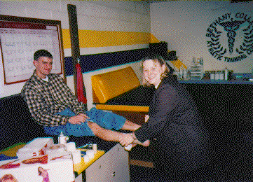 Shelly Turner administers treatment to a Bethany athlete
