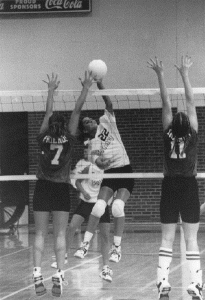 Robyn Velasco spikes the ball (photo by Tim Sorenson)