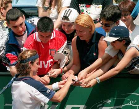signing autographs