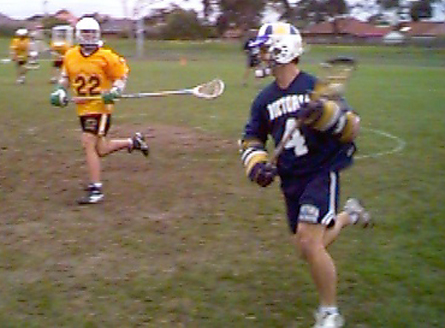 Western Australia's Thomas Cahill Defending Victoria's Darren Gibson