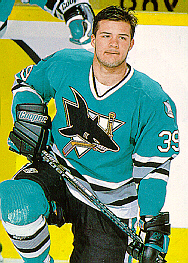 Jeff Friesen kneeling on the ice