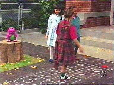 Kathy, Min, and Tosha are playing hopscotch.