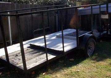 Modified trailer holds curved track.
