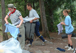 Virpi, Antti and Hilla set up camp