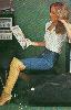 Dark-blond girl with knee-boots and Tight Jeans