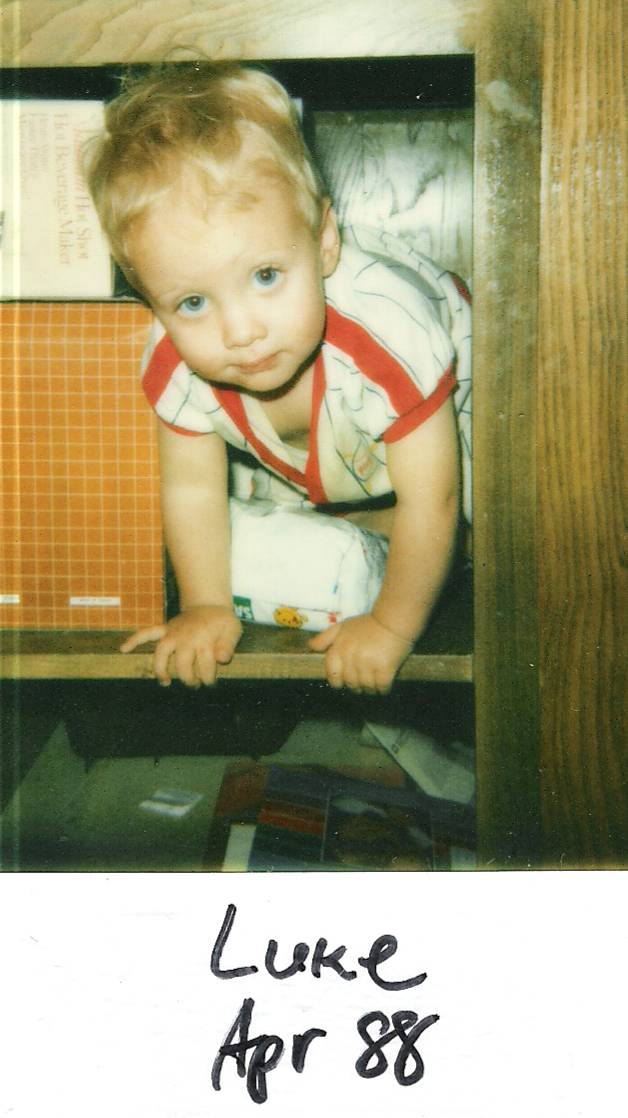 Luke hiding under the kitchen counter, April 1988, San Angelo, Texas