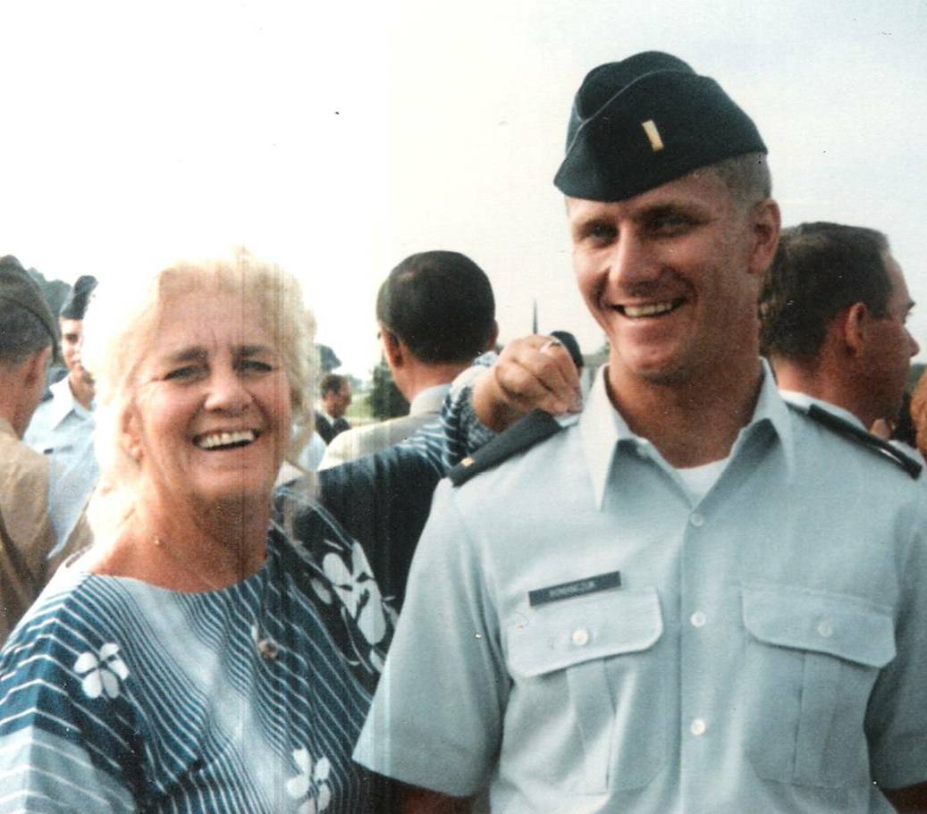 Mom buttoning on Jeff's gold bars following the graduation pass in review, Medina Annex, Lackland AFB, Texas, 4 October 1985