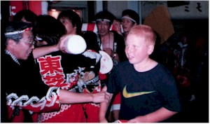 Matt getting dragged into helping them with the float at a Festival at Misawa 