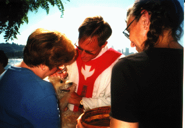Dave blessing Marva's dog.