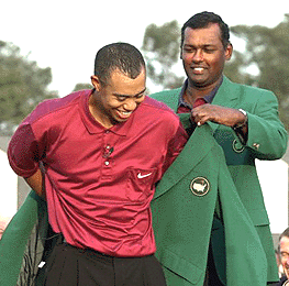 tiger receives his second green jacket from last year's winner, vijay singh
