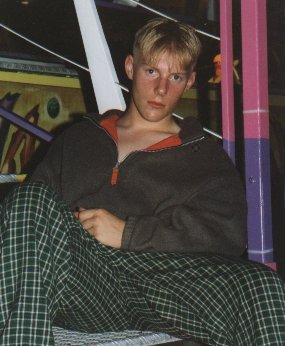 Young boy in plaid trousers.