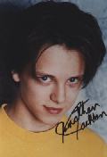 Autographed Picture. Wearing a yellow tshirt