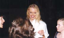Arleen giving autographs