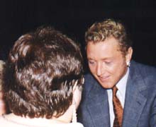 Michael signing an autograph