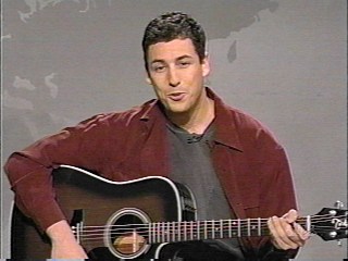 [Adam Sandler with guitar]