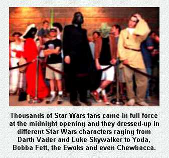 Movie goers in Star Wars costumes