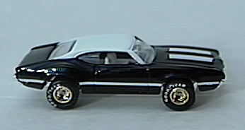 Black Olds 442 w/
gold-hubbed Real Rider tires