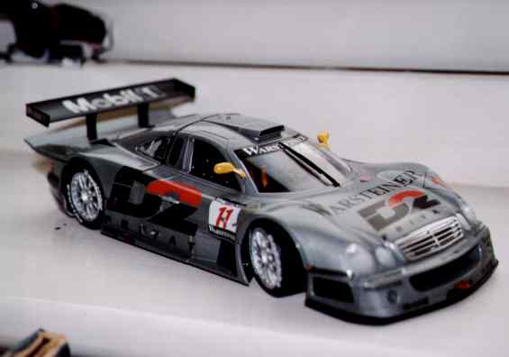 Overall the model is about ten inches long.  The wheels are approximately 2.5cm (1 inch) diameter.  That's the handle of my kitchen window in the background