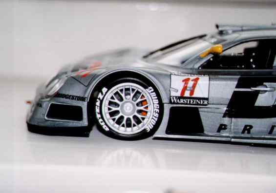 (this photo is seriously close-up - the wheels are 1 inch diameter!) I reckoned Orange calipers were a bit special :>  The cutouts on the "11" decal took ages and were very fiddly...