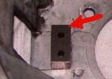 Spacer to relocate throw out arm