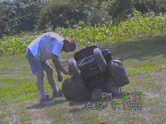 TOMMY WITH HIS BROKEN MOWER