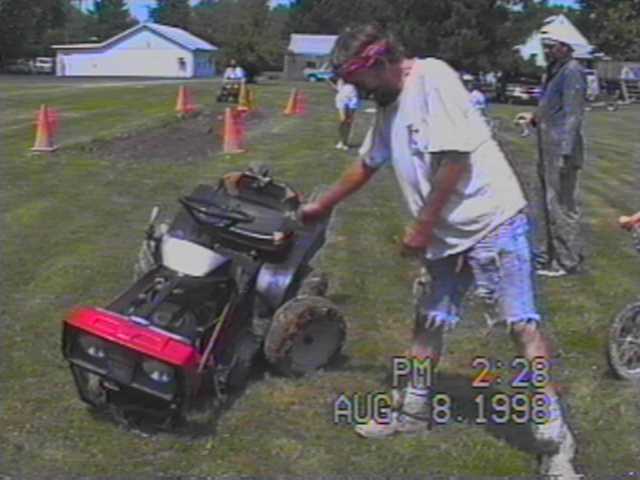TOMMY WITH HIS BROKEN MOWER