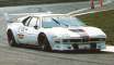 White M1 Racing around corner