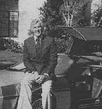 John Delorean sitting on early prototype