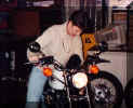 In the shop trying out the new ride.