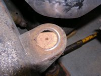 drilling out the damaged metal on the body mount