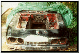 Body removed and stored under plastic sheeting 