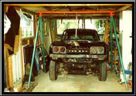 Body attached to make-shift hoist ready for removal.