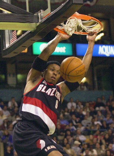 Bonzi Wells dunks in a regular season game and keeps hanging on the rim
