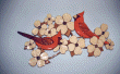 TWO CARDINALS ON DOGWOOD