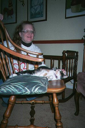 July Sleeping on a Chair and Getting an Ear Scratch from Mom
