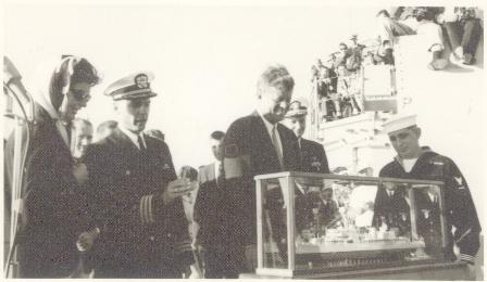 President Kennedy examines the carved model