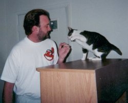Dog high fives daddy