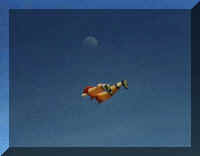 Dad's double moon...the bottom half of a soccer player kite and a moon above the kite (5606 bytes)
